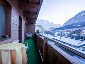 a balcony with a table and a view of mountains at Apartment Bichleregg by Interhome in Sautens