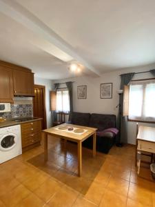 a living room with a couch and a table at Apartamento Fray Eloy de 1 habitacion in Guadalupe