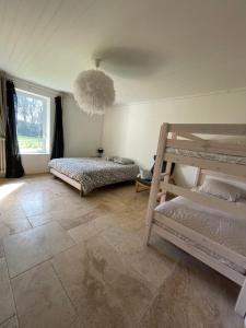 Postel nebo postele na pokoji v ubytování Le Saule