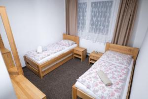 Katil atau katil-katil dalam bilik di Horská chata Primula - 1000 m nad morom