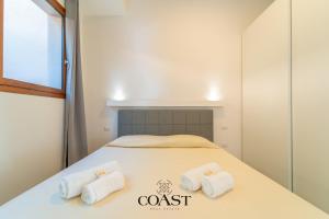 Ένα ή περισσότερα κρεβάτια σε δωμάτιο στο White Sea House - Trilocale Moderno e spazioso