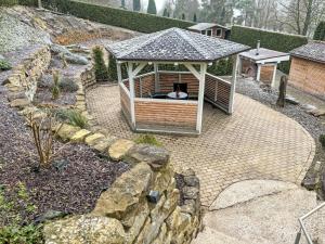 a gazebo with a dog laying in it at Apartment Am Waldrand by Interhome in Lügde