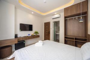 Postel nebo postele na pokoji v ubytování Tiamo Hotel