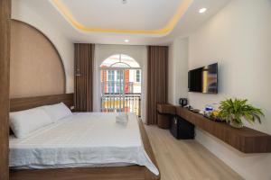 Postel nebo postele na pokoji v ubytování Tiamo Hotel