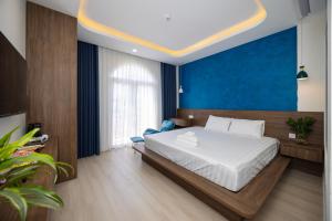 Postel nebo postele na pokoji v ubytování Tiamo Hotel
