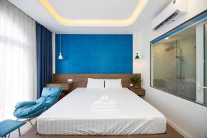 Postel nebo postele na pokoji v ubytování Tiamo Hotel