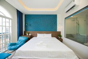 Postel nebo postele na pokoji v ubytování Tiamo Hotel