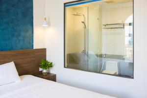 Koupelna v ubytování Tiamo Hotel + 37 fotografií