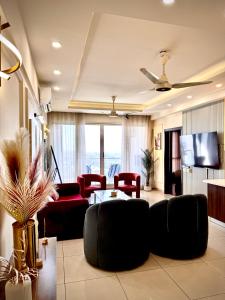 Μια τηλεόραση ή/και κέντρο ψυχαγωγίας στο Elysium Tower Cozy 2Bhk with Netflix & City Views