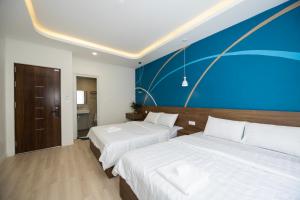 Postel nebo postele na pokoji v ubytování Tiamo Hotel