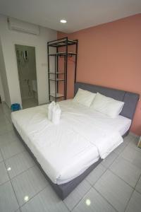 Postel nebo postele na pokoji v ubytování Gemilang Hotel Klang