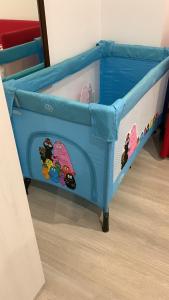 a blue bunk bed with cartoon characters on it at Casa di Leo in Loano