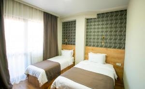Postel nebo postele na pokoji v ubytování Astana Palace