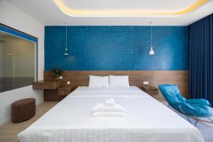 Postel nebo postele na pokoji v ubytování Tiamo Hotel