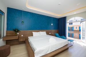 Postel nebo postele na pokoji v ubytování Tiamo Hotel