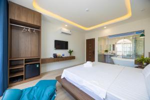 Postel nebo postele na pokoji v ubytování Tiamo Hotel