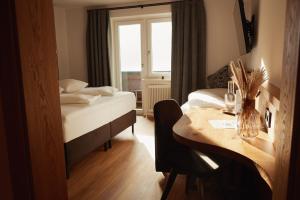 Ein Bett oder Betten in einem Zimmer der Unterkunft Gasthof Schütthof