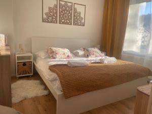 Postel nebo postele na pokoji v ubytování Labela Luhačovice Apartment