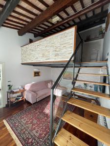 a room with a loft bed and a staircase at Elena Casa Turistica in Padova
