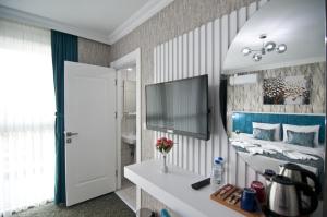 TV a/nebo společenská místnost v ubytování Hill Life Hotel