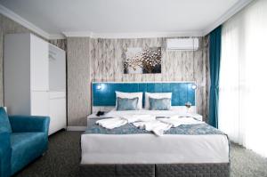 Postel nebo postele na pokoji v ubytování Hill Life Hotel