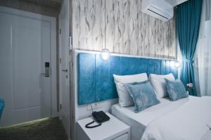 Postel nebo postele na pokoji v ubytování Hill Life Hotel