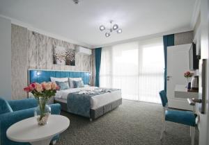 Postel nebo postele na pokoji v ubytování Hill Life Hotel