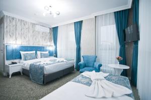 Postel nebo postele na pokoji v ubytování Hill Life Hotel