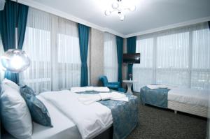 Postel nebo postele na pokoji v ubytování Hill Life Hotel