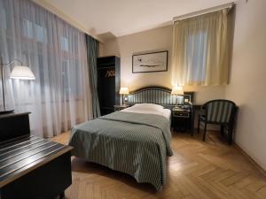 Posteľ alebo postele v izbe v ubytovaní Elysee Hotel