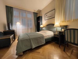 Posteľ alebo postele v izbe v ubytovaní Elysee Hotel
