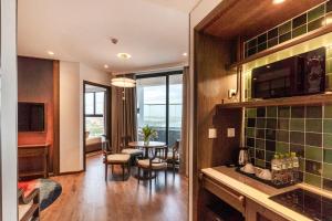 Η κουζίνα ή μικρή κουζίνα στο Apec Mandala Apartment Sunrise & Sea View