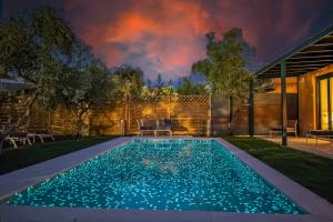 a swimming pool in the backyard of a house at Galene Eco Luxury Villas in Acharavi