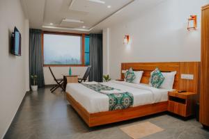 En eller flere senge i et værelse på Saj Heritage