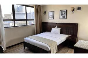 Postel nebo postele na pokoji v ubytování Hemak Suites Hotel