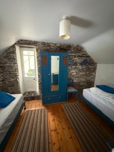 Postel nebo postele na pokoji v ubytování John's House - Caherdaniel