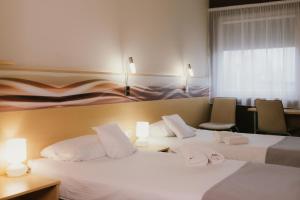 Postel nebo postele na pokoji v ubytování Quality Silesian Hotel + 37 fotografií