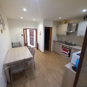 a kitchen and dining room with a table and chairs at rismondi 37 in Bari +10 photos