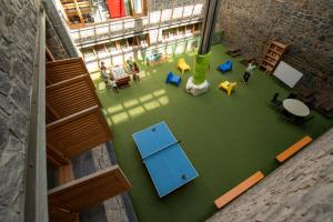 an overhead view of a room with people in a building at Alberg Naturland in Sant Julià de Lòria +5 photos