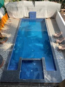 Bazén v ubytování Aura rooms & swimming pool, calangute nebo v jeho okolí
