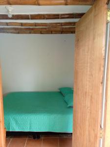 Postel nebo postele na pokoji v ubytování Botón de oro hostal + 5 fotografií