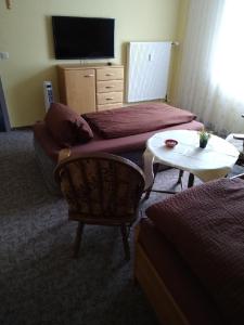 a living room with a couch and a table at FeWo 12 45qm bis 3 Pers nahe Winterberg in Schmallenberg