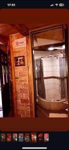 a kitchen with a mirror and a brick wall at Brvnare Dolic in Sarajevo +30 photos