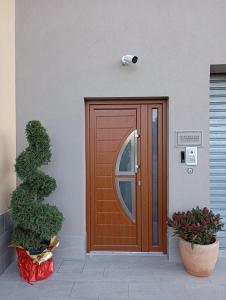 a wooden door on the side of a building at Morcone B&B Affittacamere in Morcone