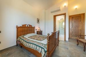A bed or beds in a room at Villa Fico 2