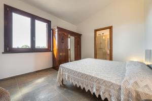 A bed or beds in a room at Villa Fico 2