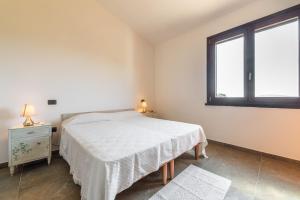 A bed or beds in a room at Villa Fico 2