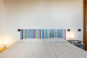 A bed or beds in a room at Villa Fico 2