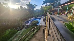 a group of cars parked next to a pool at Iraka Campestre Quindio in El Edén