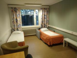 Postel nebo postele na pokoji v ubytování Grand Hostel Ivalo